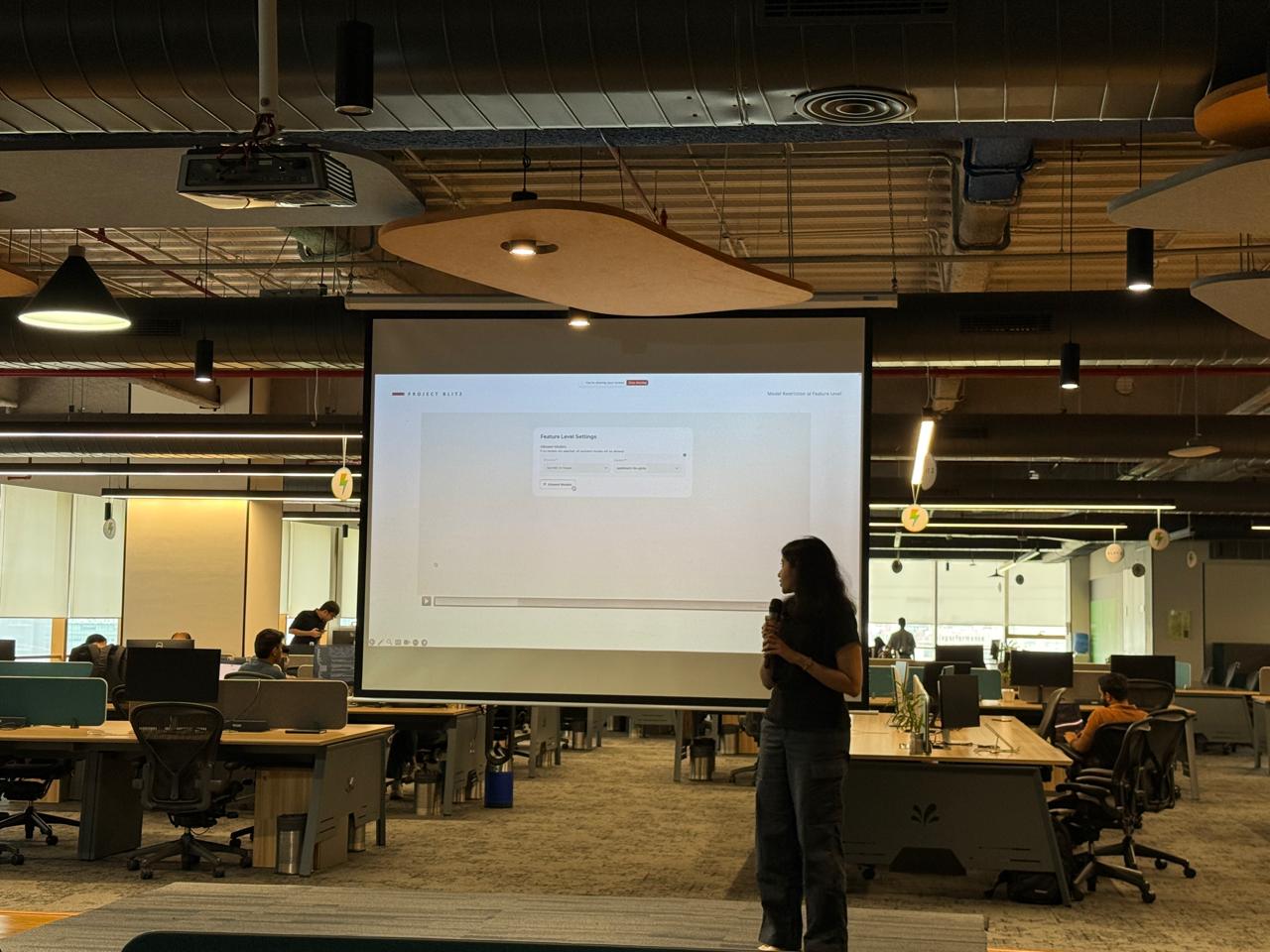 Aditi presenting a product demo in the office